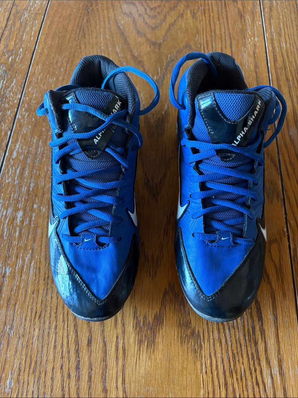Nike Alpha Shark Football Cleats  in a game royal black and white color.